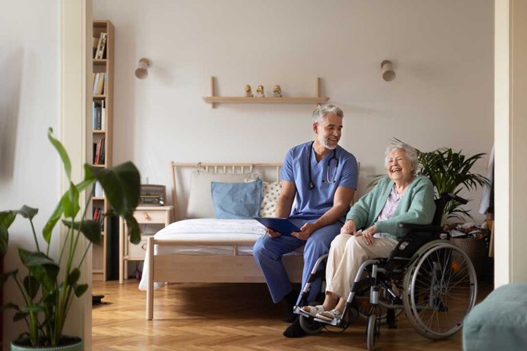 An older adult decorates a cozy room with family photos and personal keepsakes.